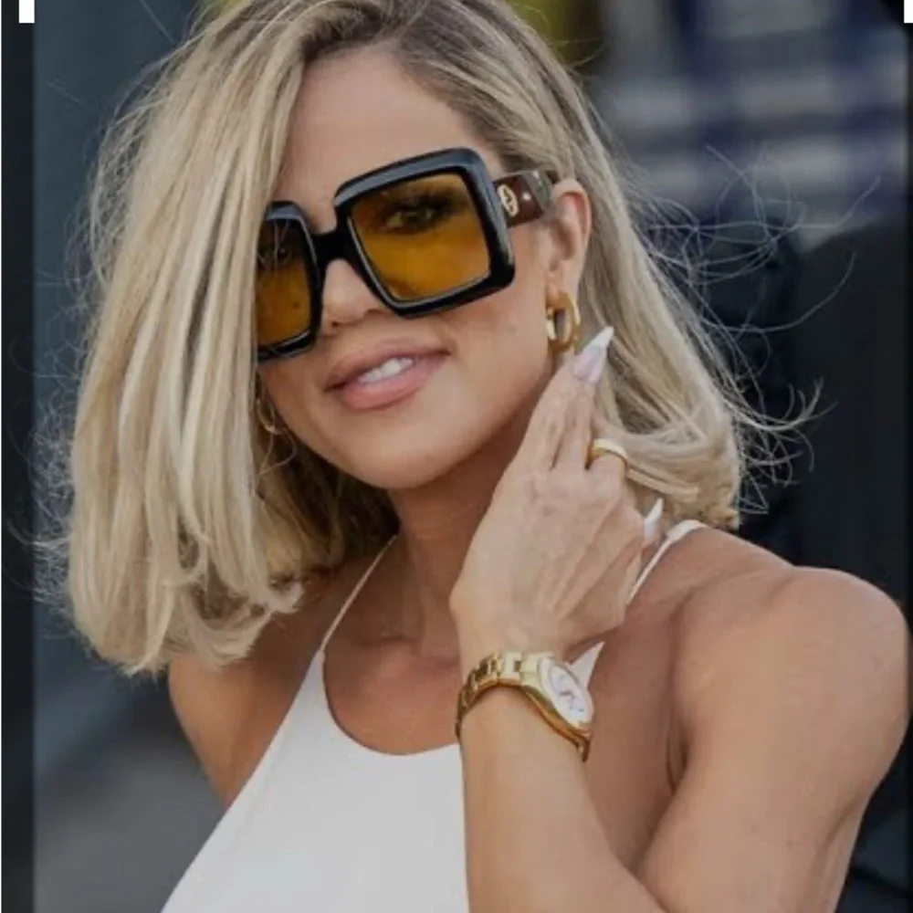 Gucci Women's Sunglasses with Black Frame and Gold Lenses - Picture 7 of 7